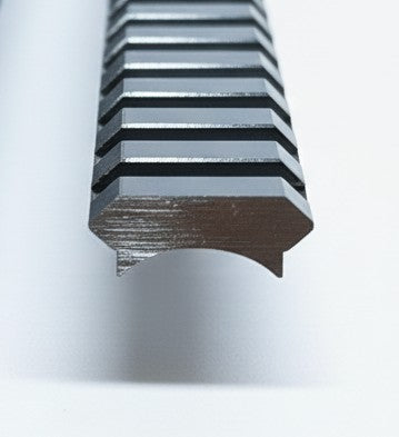 End view of a radius base weldable picatinny rail on a white background